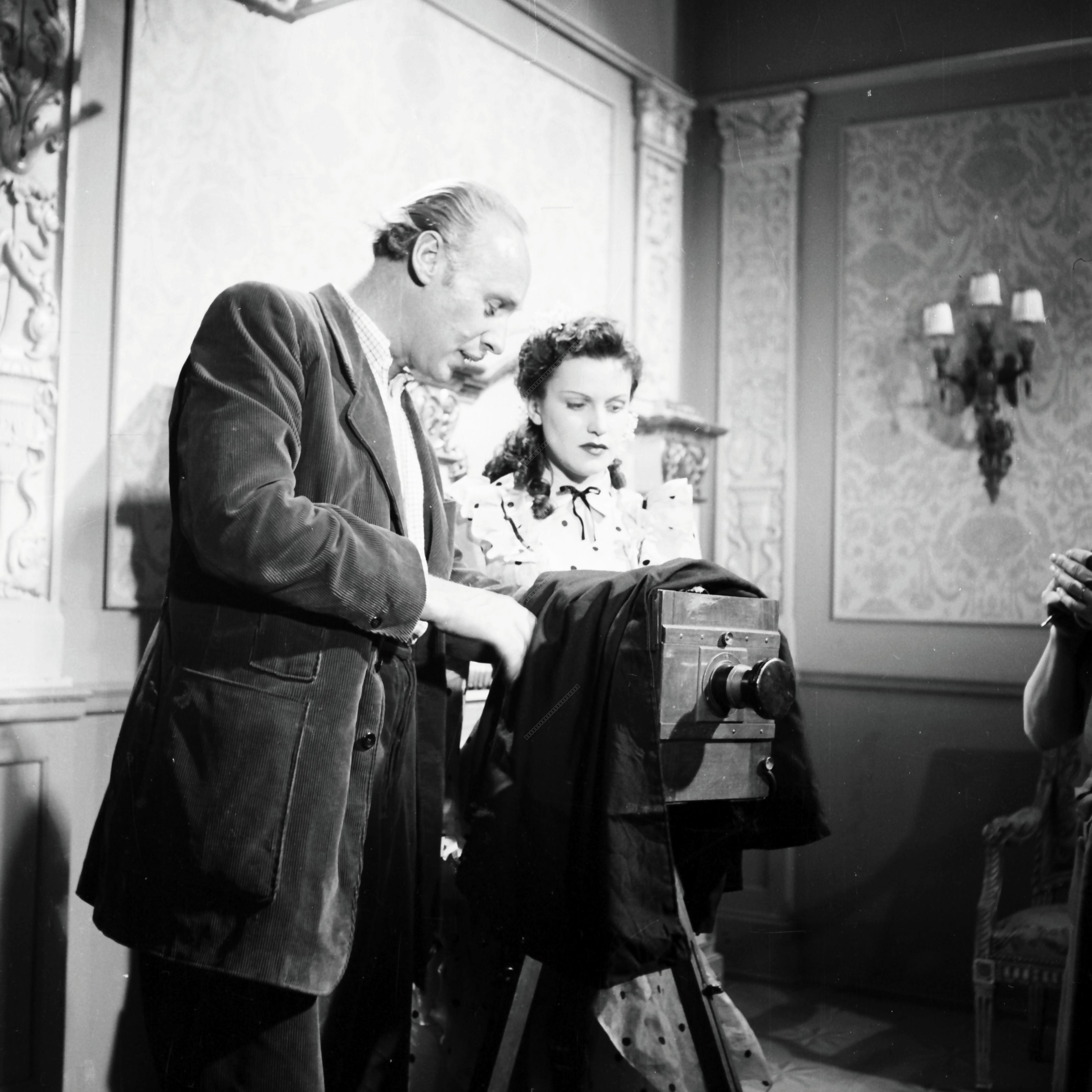 Photographer and Actress on Set with Historical Camera